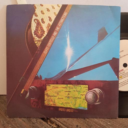 ELVIS COSTELLO and the ATTRACTIONS. radio radio. tiny steps. 7" vinyl SINGLE. ADA24