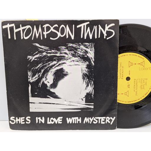THOMPSON TWINS She's in love with mystery, Fat food/food style, 7" vinyl SINGLE. LATE1
