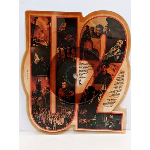 U2 A sort of homecoming 7" cut-out picture disc single. ISP220